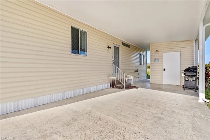 Property entrance featuring a patio
