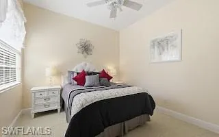 Bedroom featuring baseboards and ceiling fan