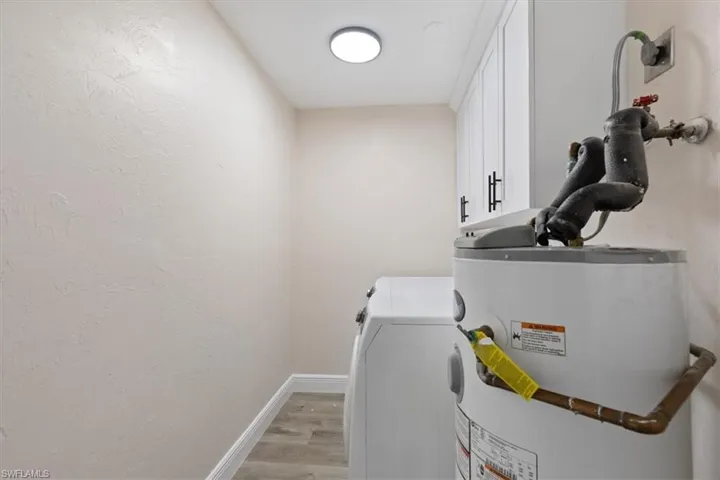 Laundry room with water heater