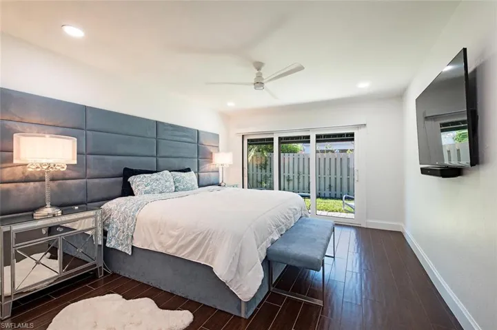 Bedroom with access to outside, recessed lighting, dark wood-style floors, and ceiling fan
