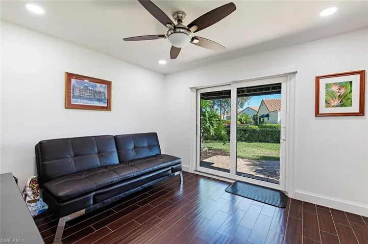 Sitting room featuring wood tiled floors, recessed lighting, and a ceiling fan