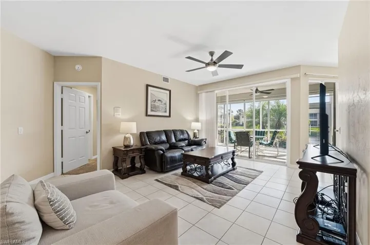 Tile flooring flows throughout the main living area, creating a light and bright space while showcasing beautiful lake views.