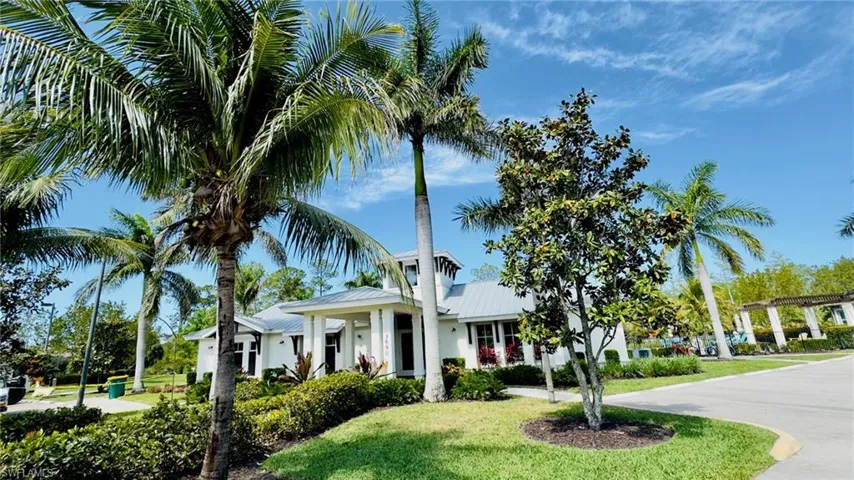 View of front of home featuring a front lawn and metal roof