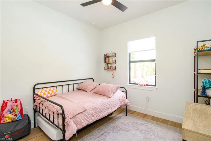 Bedroom 3 featuring wood-type flooring and ceiling fan