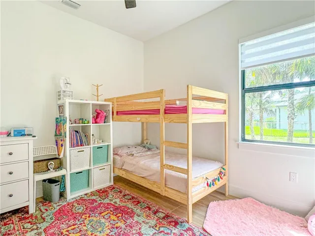 Bedroom 2 featuring ceiling fan and hardwood / wood-style flooring