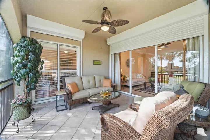 View of patio / terrace with outdoor lounge area, ceiling fan, and a sunroom
