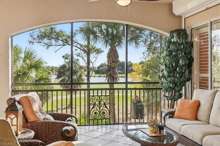 Sunroom / solarium featuring a water view and healthy amount of natural light