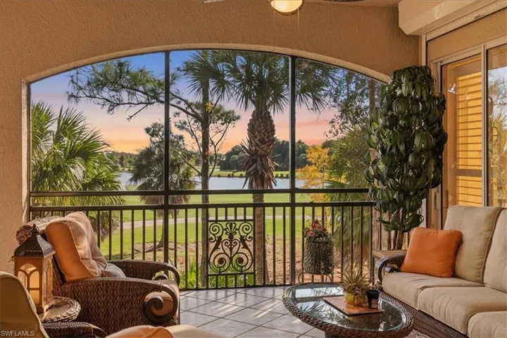 Sunroom with a water view
