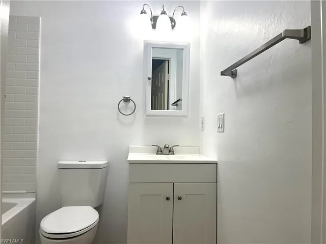 Bathroom featuring vanity and  shower combination