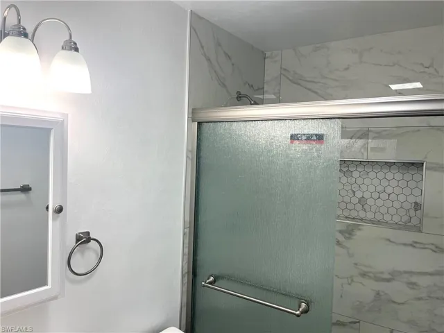 Bathroom featuring a shower stall