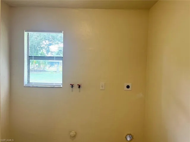 Laundry area featuring gas dryer hookup, hookup for a washing machine, and electric dryer hookup
