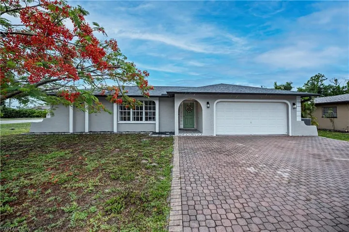 Ranch-style home featuring a garage