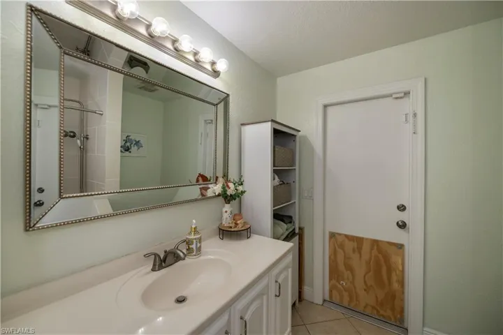 Bathroom featuring tile flooring and oversized vanity