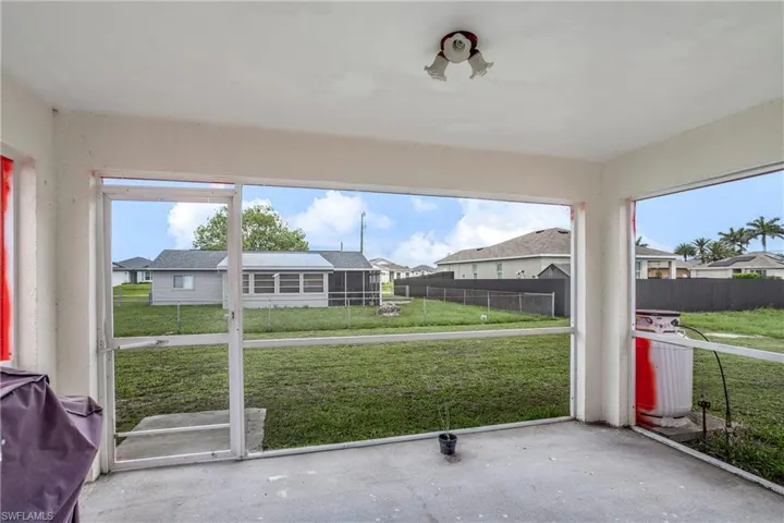 Unfurnished sunroom featuring a residential view