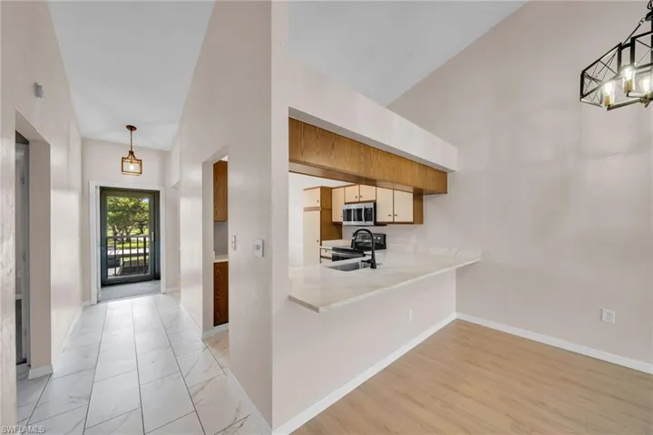Dining room with Kitchen and entrance view