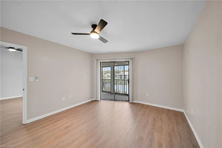 Master bedroom with Big lake view leading to enclosed sunroom