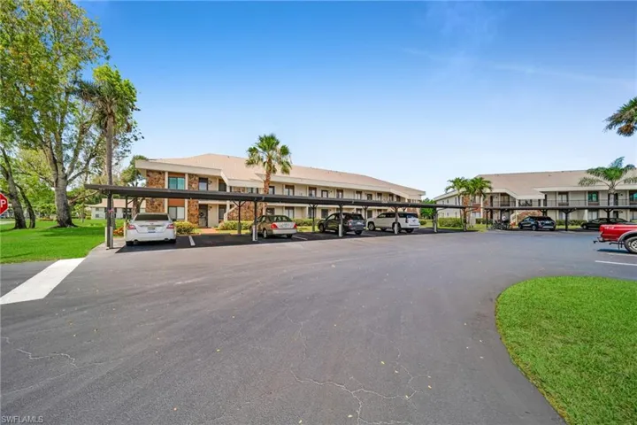 View of front of home with covered and uncovered parking, Deeded Covered parking