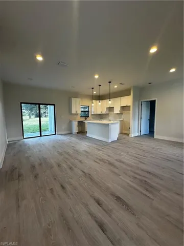 Unfurnished living room with light wood-type flooring