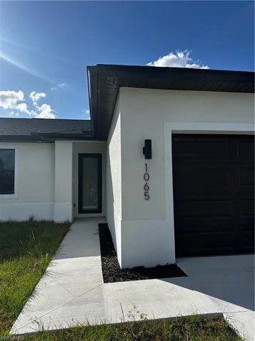 View of exterior entry featuring a garage