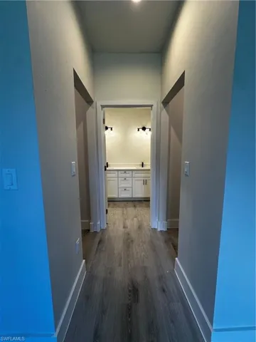 Hallway featuring dark hardwood / wood-style flooring