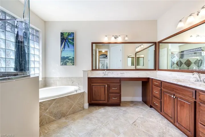 Ensuite primary bathroom with plenty of space for two.