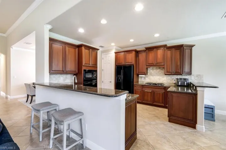 The breakfast bar serves as a casual dining spot.