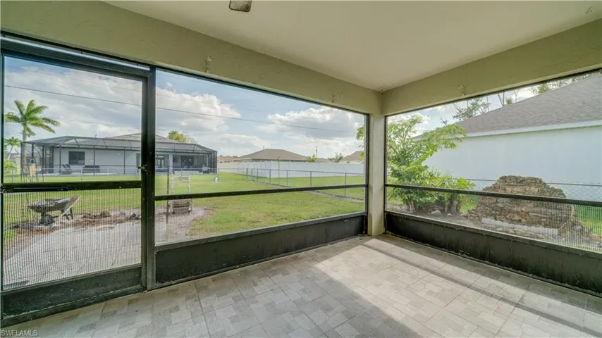 Screened lanai with tile floor.