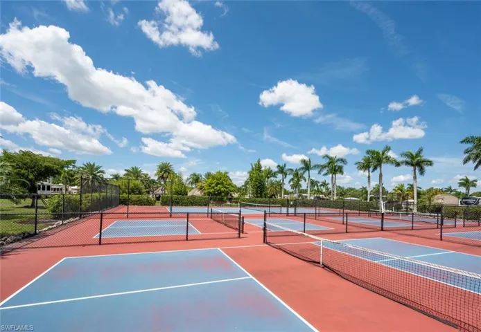 View of tennis court with community basketball court