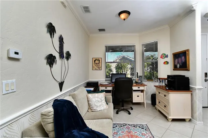 Tiled office featuring crown molding