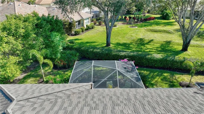 View of property's community featuring a lawn