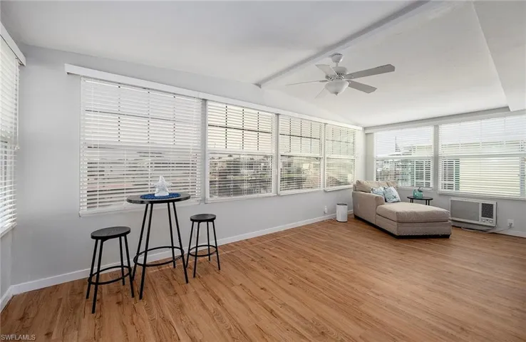 Sunroom / solarium featuring ceiling fan