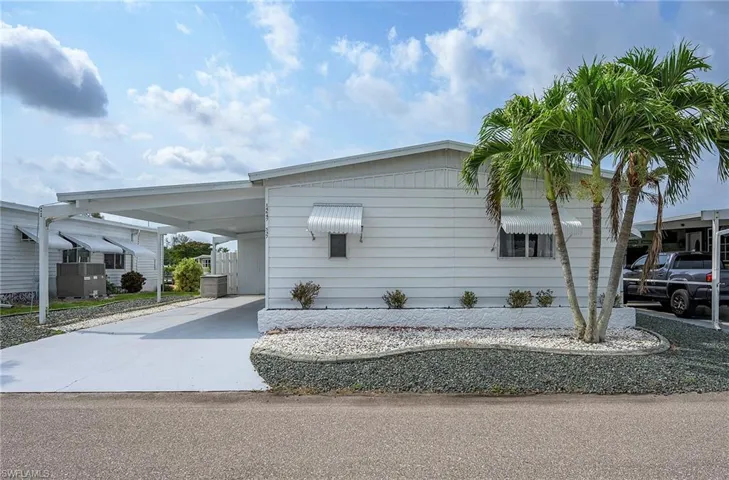 View of front of property with a carport