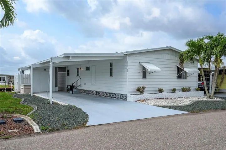 View of front of property featuring a carport