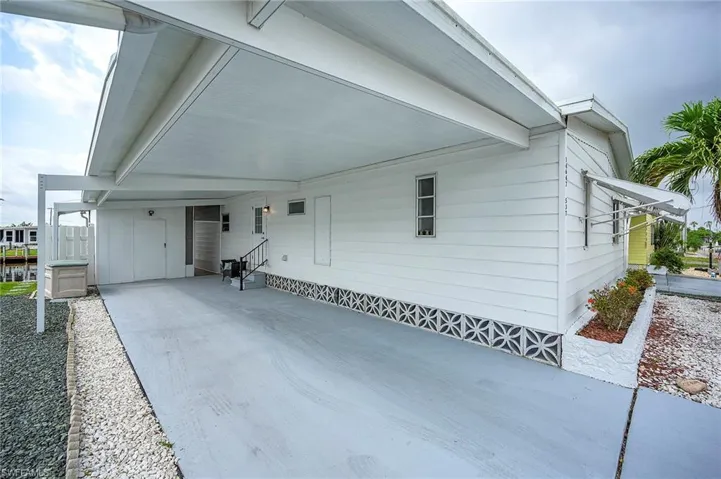 View of front of property with a carport