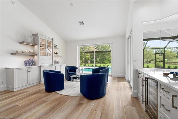 Built in Cabinets, sitting area, Bar with wine cooler, everything you need .