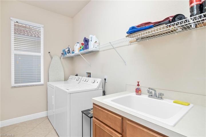 Laundry room with slop sink