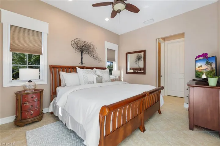 Tiled bedroom with ceiling fan