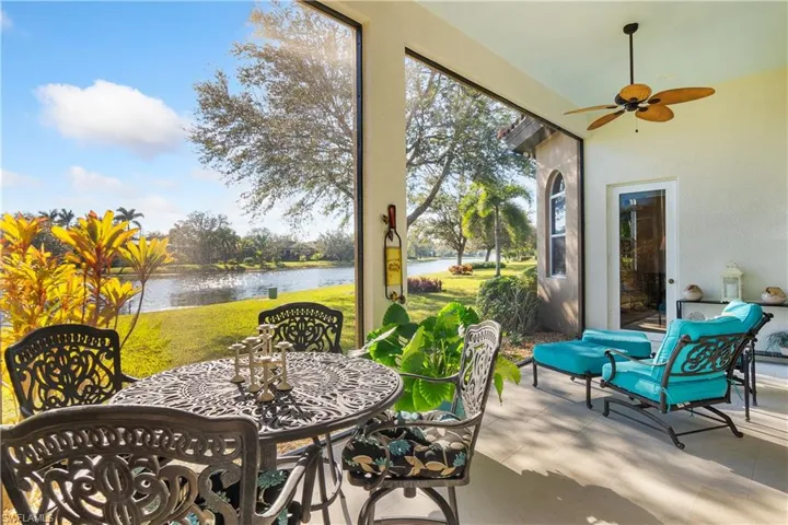 View of patio / terrace with a water view and ceiling fan