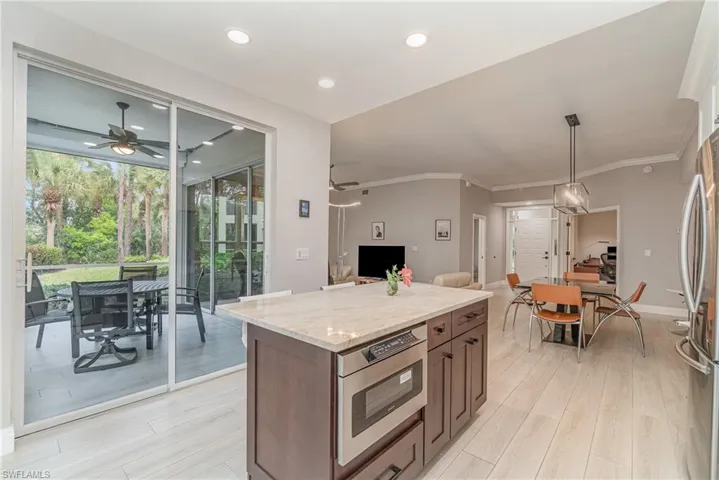 Kitchen with beautiful island and view of the lanai