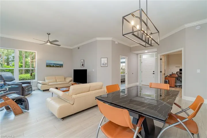Open dining and living room with plenty of natural light