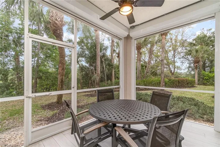Lanai featuring ceiling fan and electric shutters