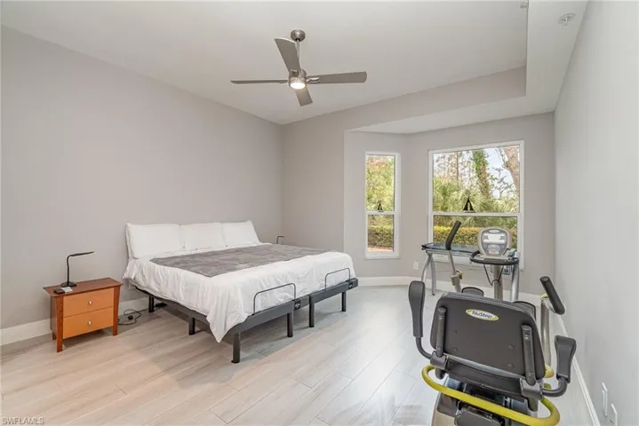 Primary Bedroom featuring ceiling fan and light tile flooring
