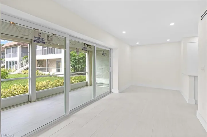 Unfurnished room featuring a healthy amount of sunlight