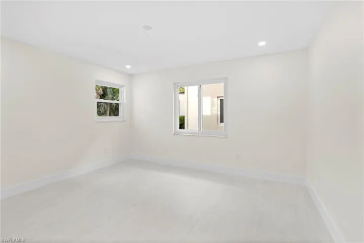 Spare room featuring hardwood / wood-style flooring