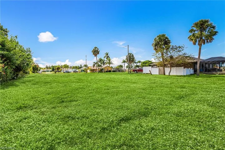 Grass has been virtually staged. Lot is mainly dirt
