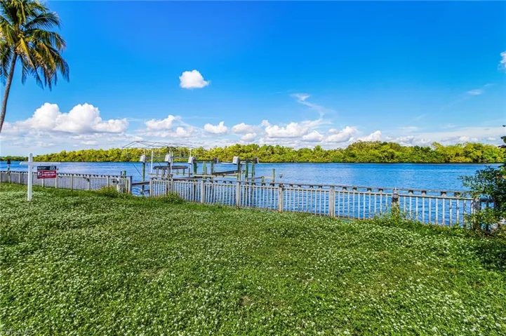 Water view featuring boat lift and a boat dock