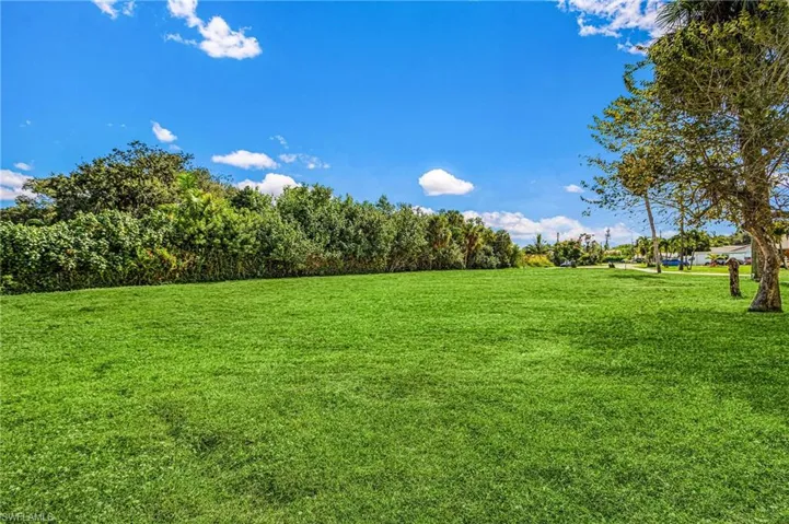 Grass has been virtually staged. Lot is mainly dirt