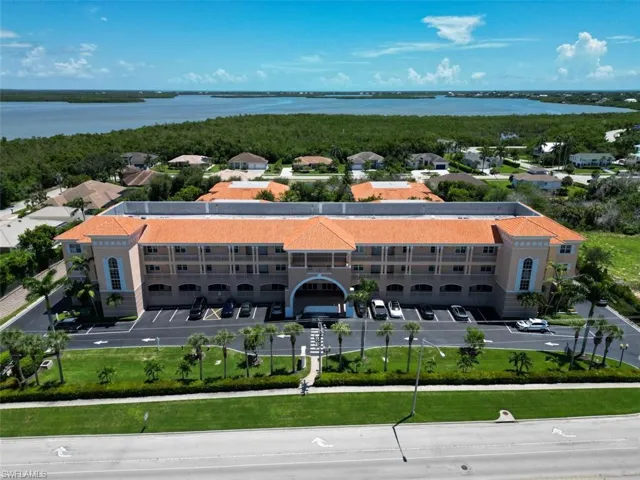 Aerial view of a large body of water and apartment complex