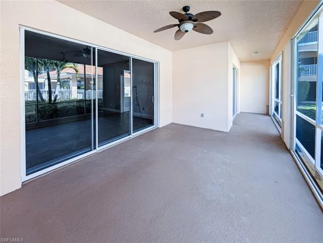 Unfurnished sunroom with a ceiling fan