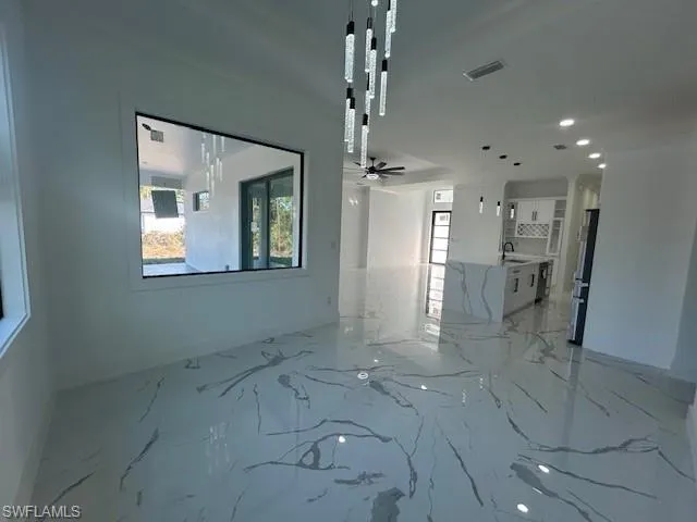 Unfurnished room with light marble finish flooring, recessed lighting, and a ceiling fan